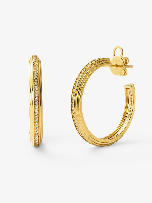 Pendientes de aro de oro amarillo de 18K con 124 diamantes en talla brillante con un total de 0,3 cts