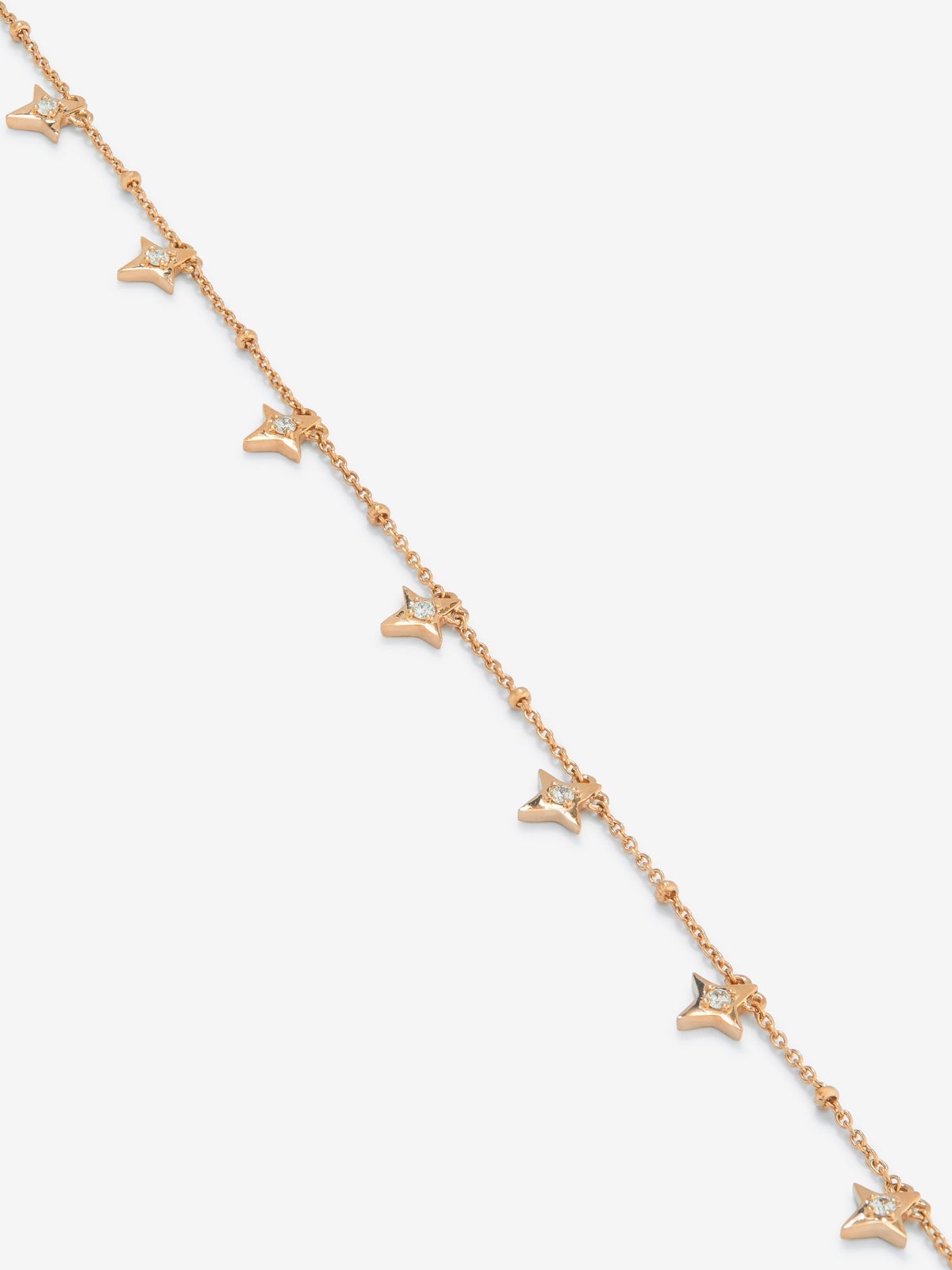 Pulsera cadena con estrellas de oro rosa de 18K con diamantes