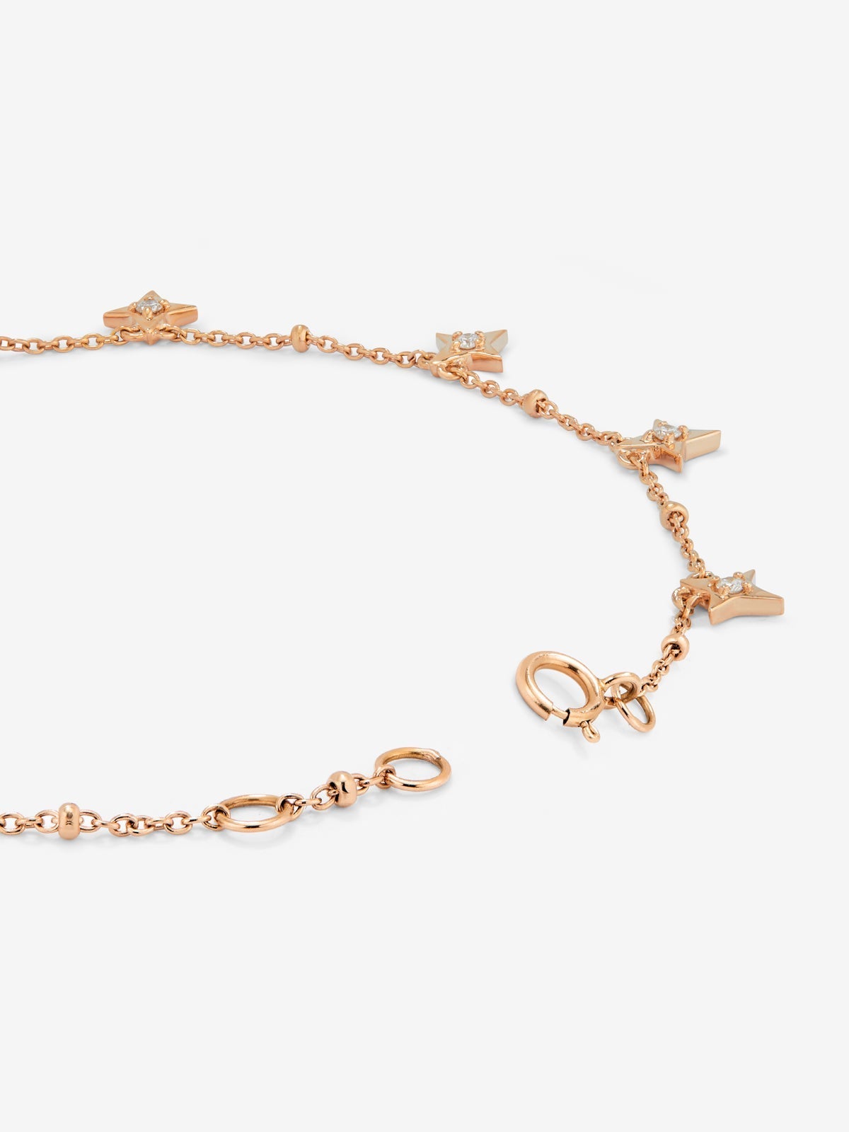 Pulsera cadena con estrellas de oro rosa de 18K con diamantes