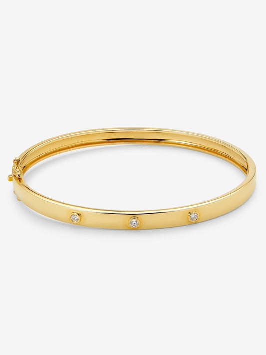 Pulsera rígida de oro amarillo de 18K con diamantes blancos en talla brillante de 0,13 cts