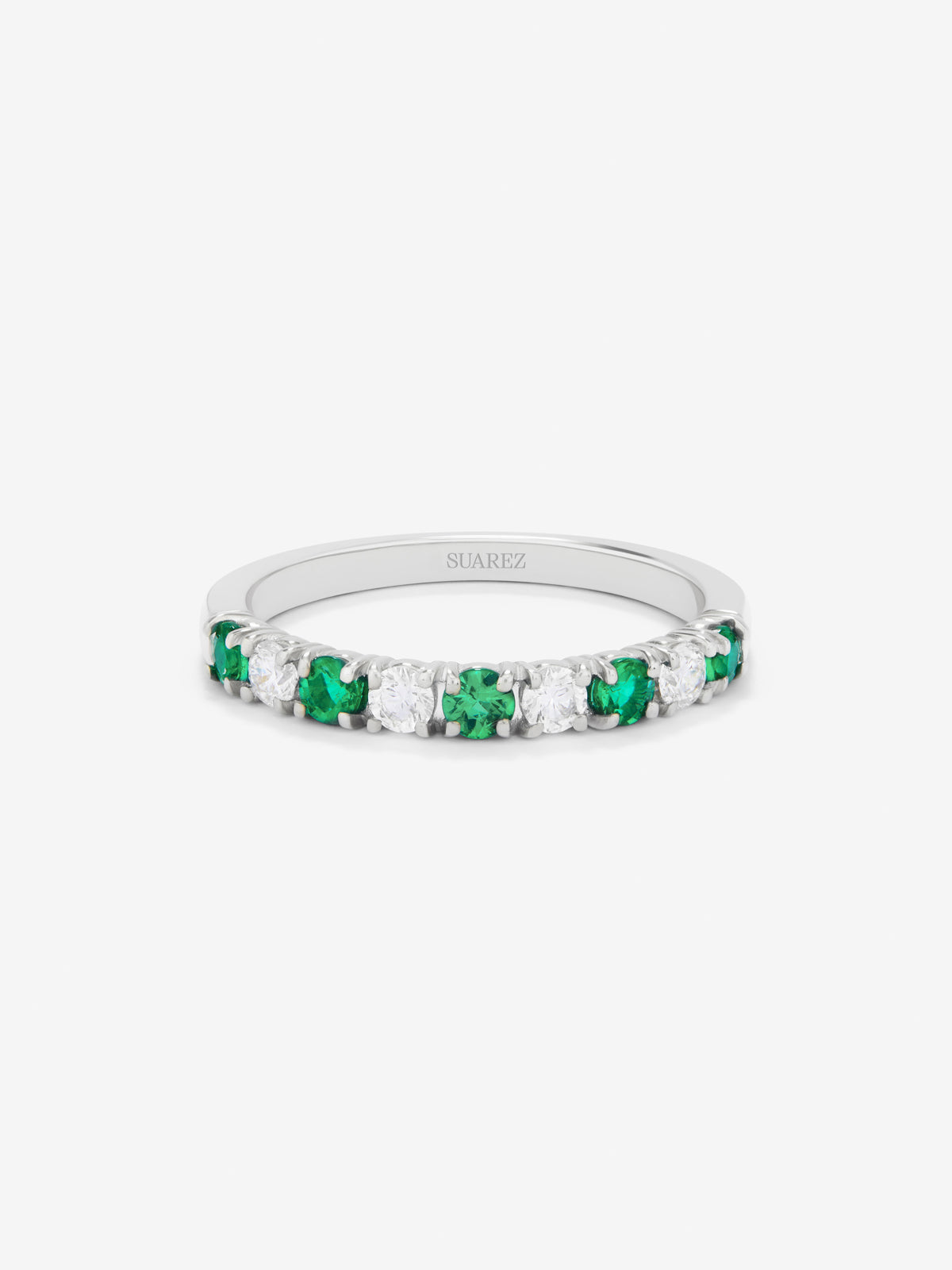 Half ring in 18K white gold with 5 brilliant-cut emeralds with a total of 0.28 cts and 4 brilliant-cut diamonds with a total of 0.23 cts