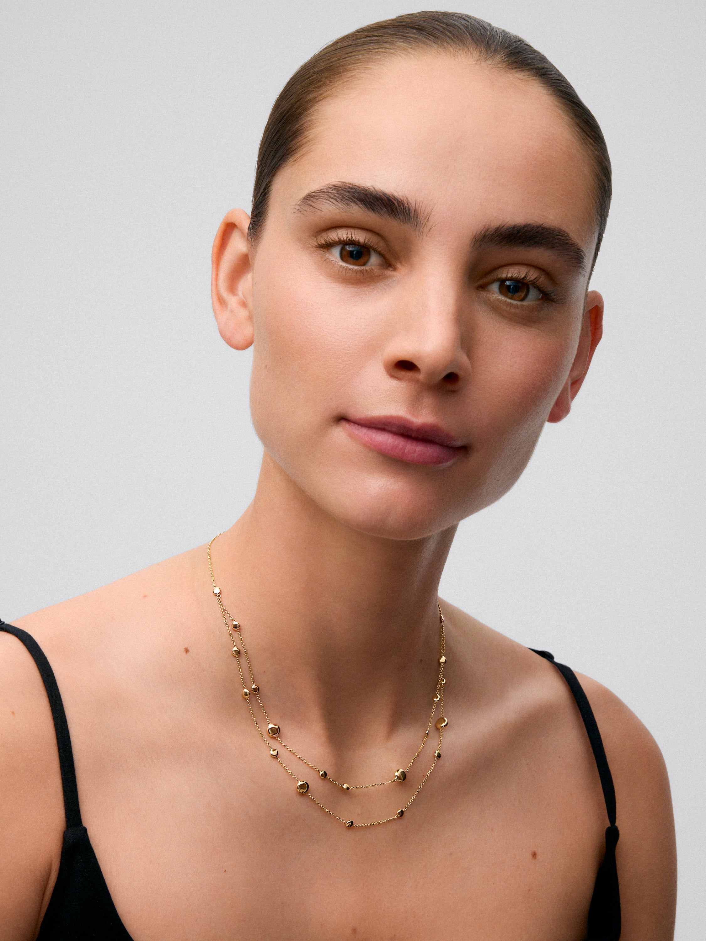 Colgante doble de oro amarillo de 18K