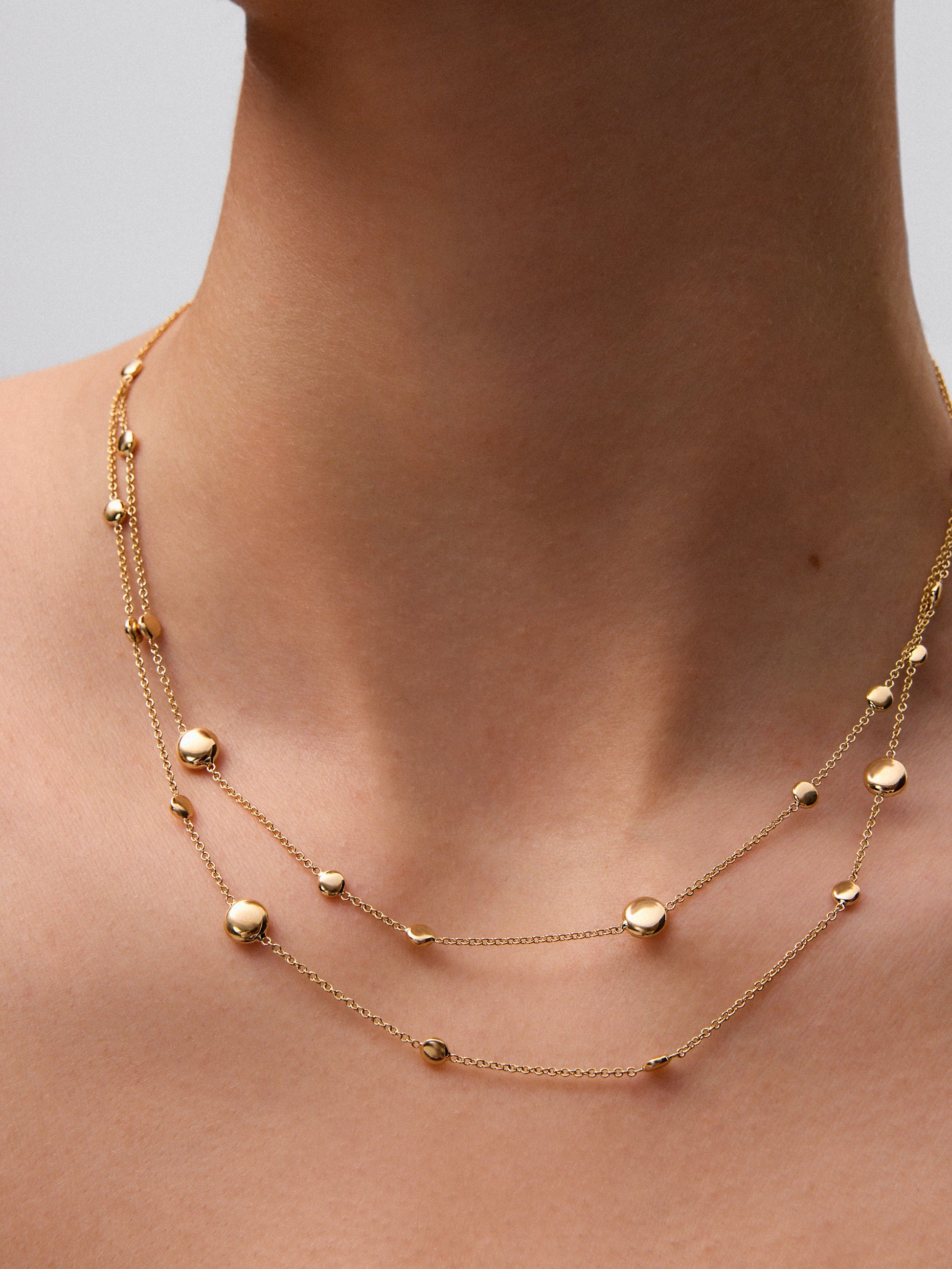 Colgante doble de oro amarillo de 18K