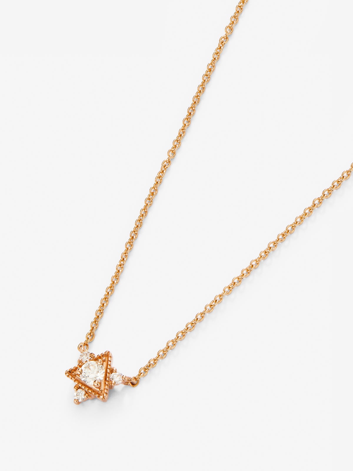 Collar de oro rosa de 18K con 4 diamantes en talla brillante con un total de 0,1 cts