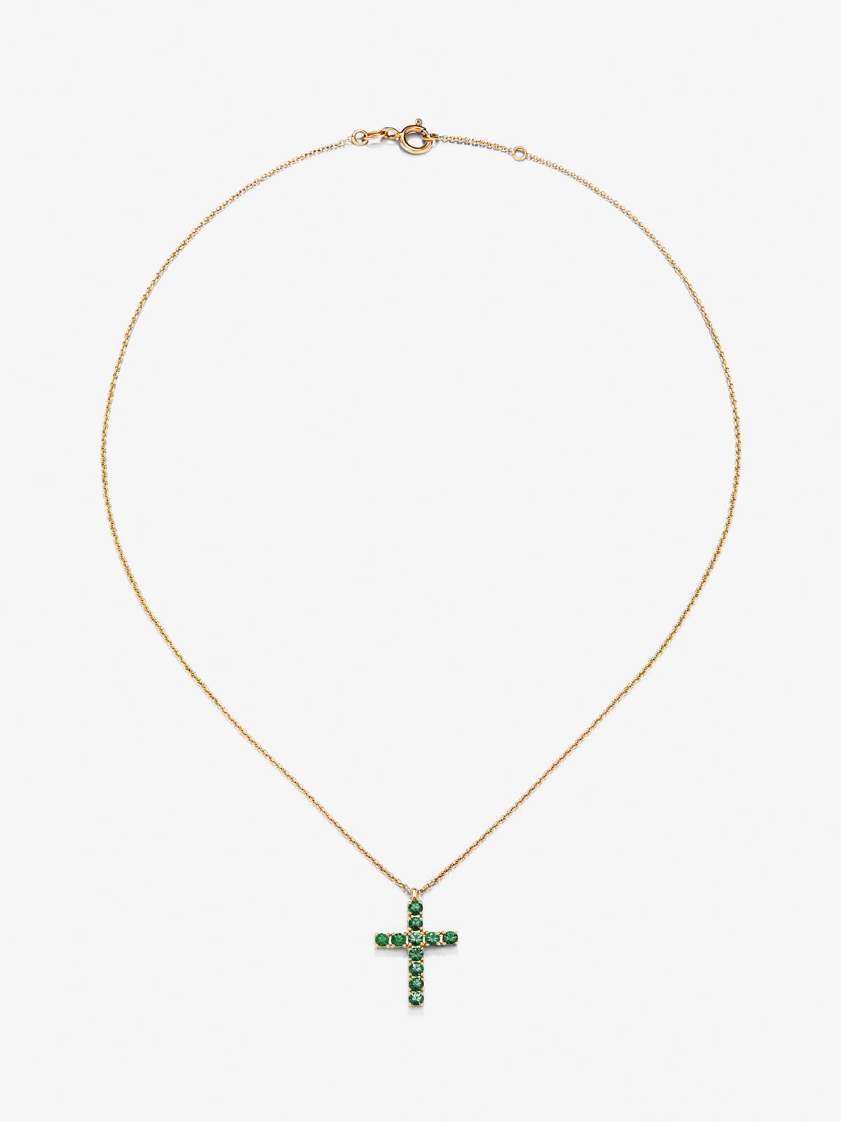 Colgante de oro amarillo de 18K con cruz de 11 esmeraldas en talla brillante con un total de 0,35 cts
