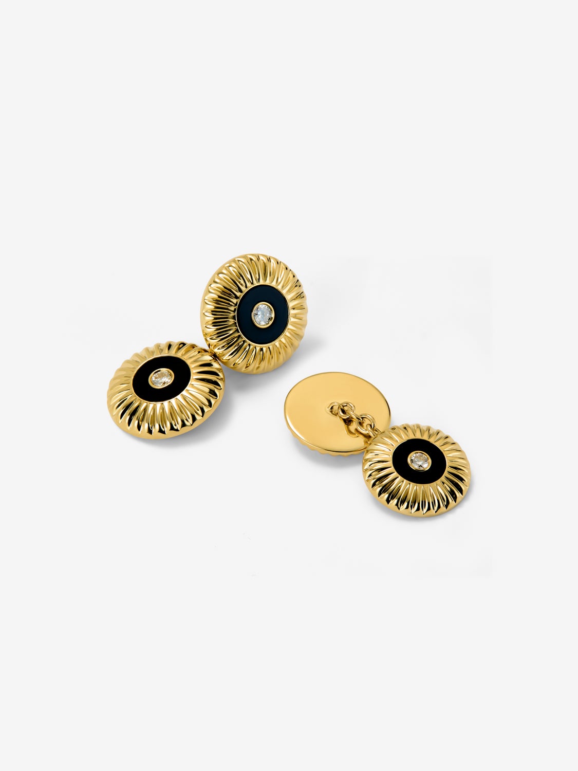 Gemelos de oro blanco de 18K con ónix negro en talla octogonal y diamantes en talla brillante con un total de 0,22 cts