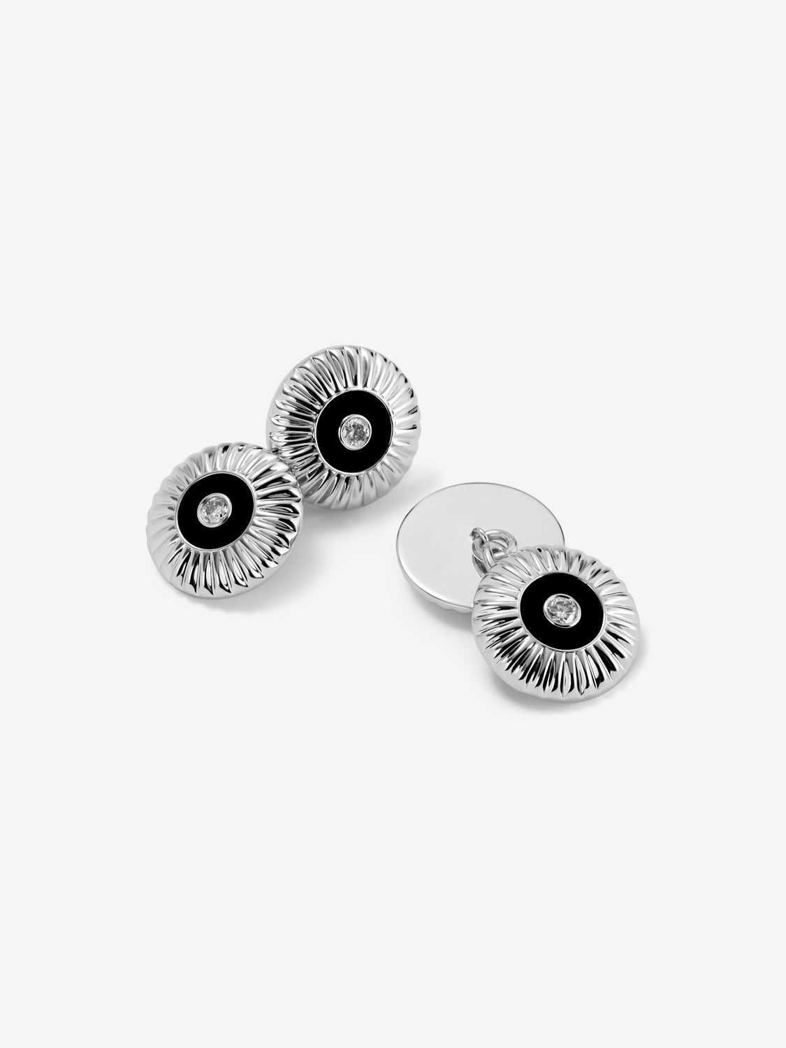Gemelos de oro amarillo de 18K con ónix negro en talla octogonal y diamantes en talla brillante con un total de 0,22 cts