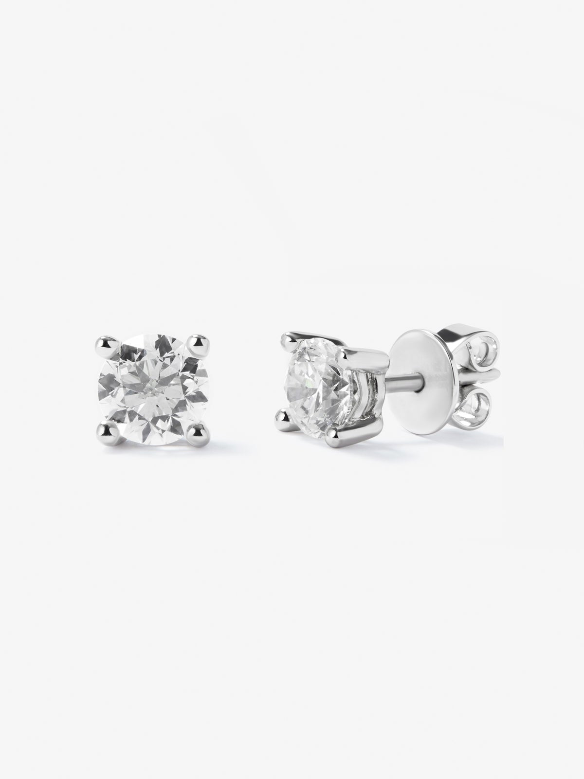 Pendientes solitarios de oro blanco de 18K con 2 diamantes en talla brillante con un total de 0,2 cts