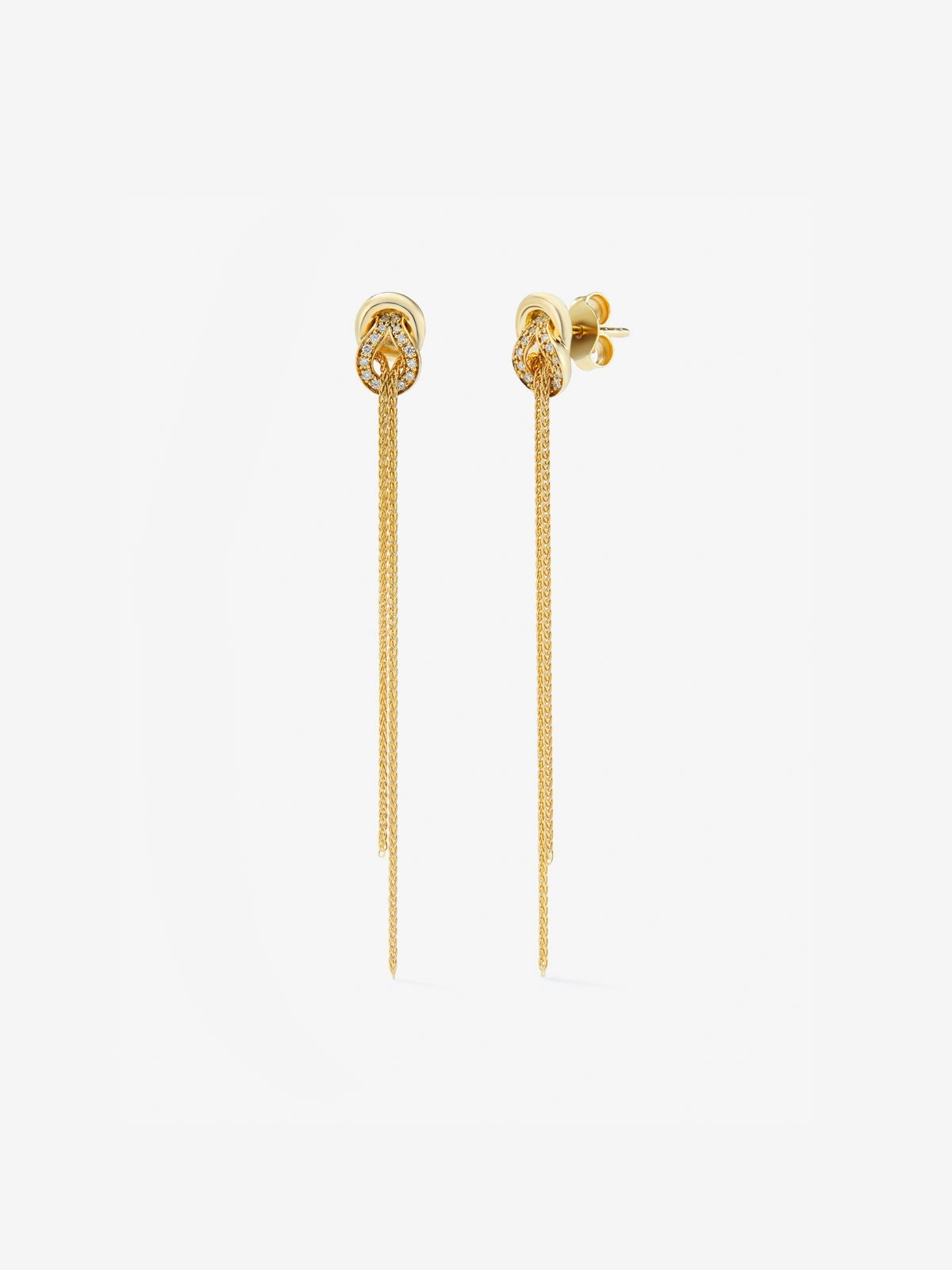 Pendientes largos de oro amarillo de 18K con diamantes blancos en talla brillante de 0,5 cts y forma de nudo