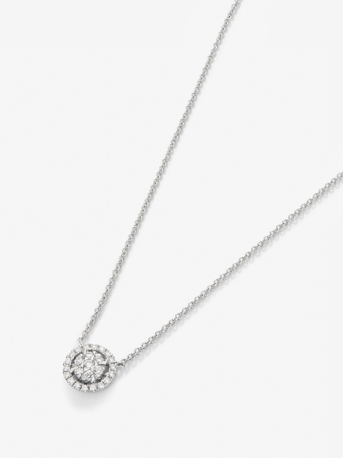 Colgante de oro blanco de 18K con 25 diamantes en talla brillantes con un total de 0,31 cts