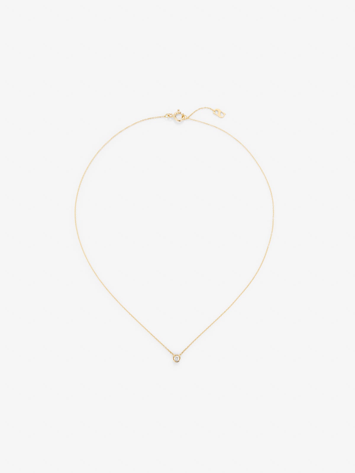 Colgante solitario de oro amarillo de 18K con diamante blanco en talla brillante de 0,05 cts