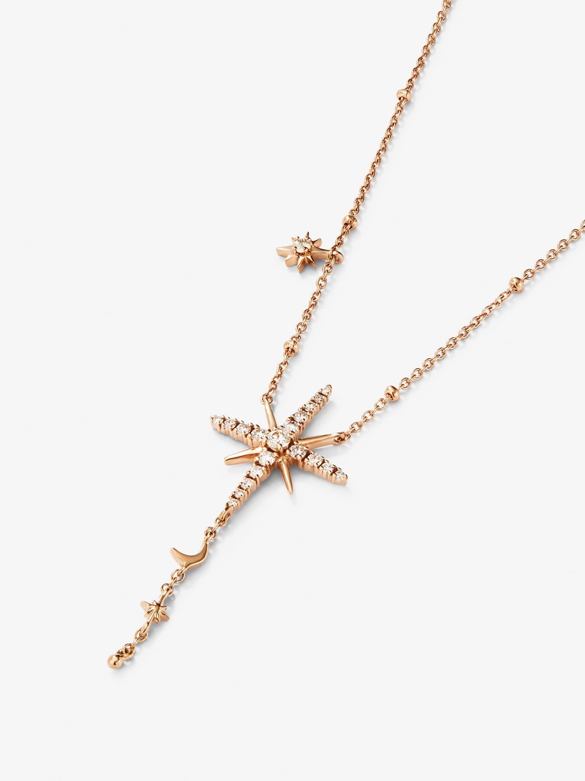 Colgante cadena largo con estrella de oro rosa de 18K con diamantes