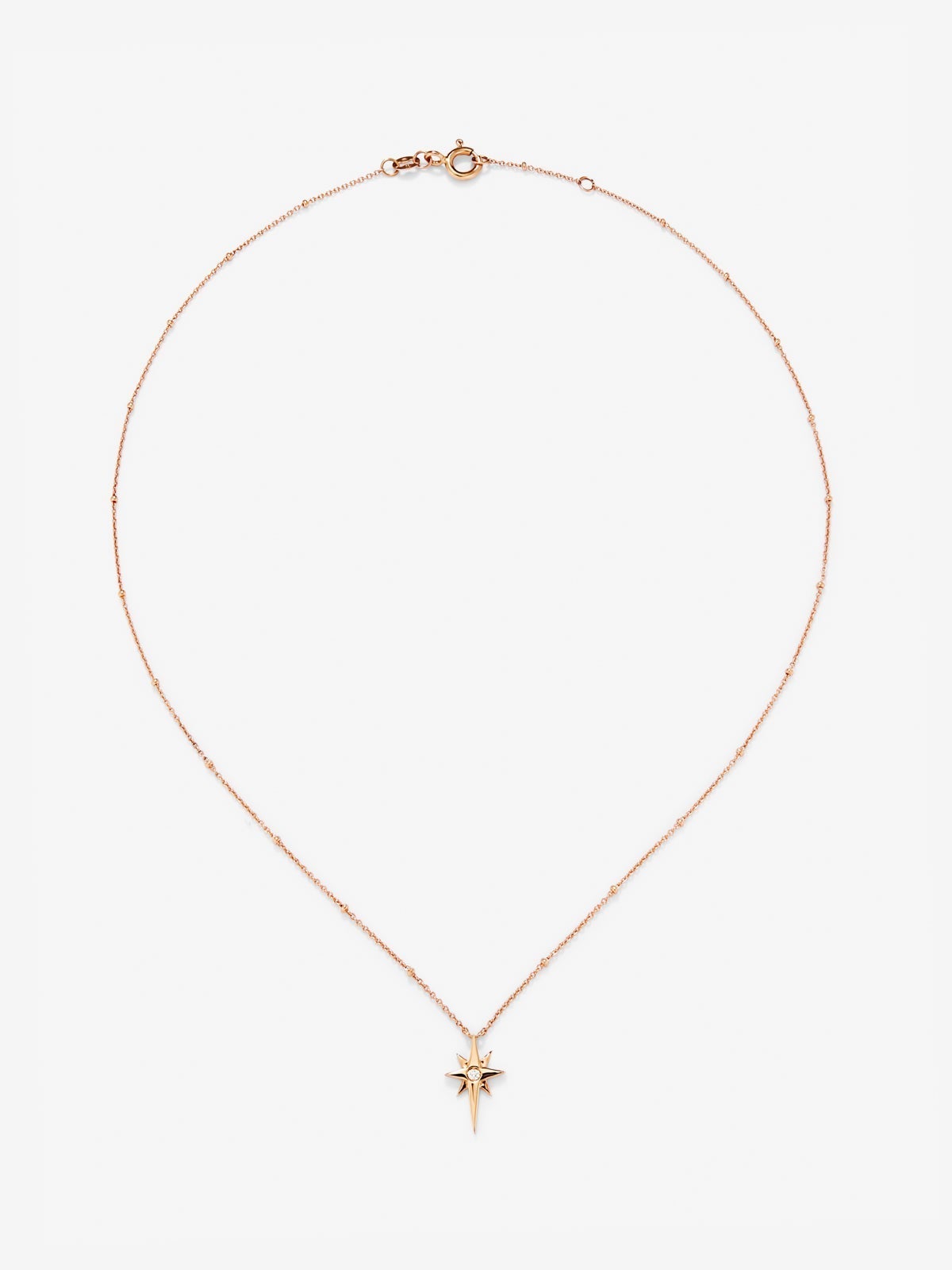 Colgante cadena con estrella de oro rosa de 18K con diamante