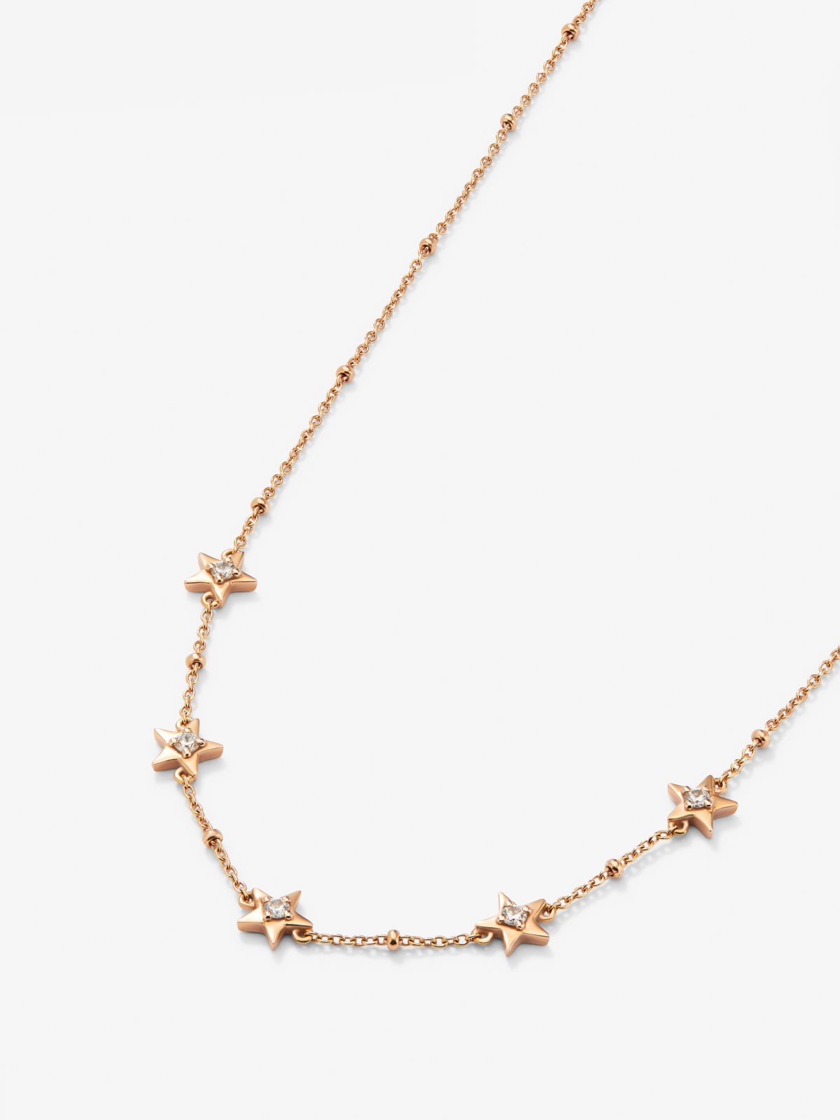 Colgante con estrellas de oro rosa de 18kt con diamantes