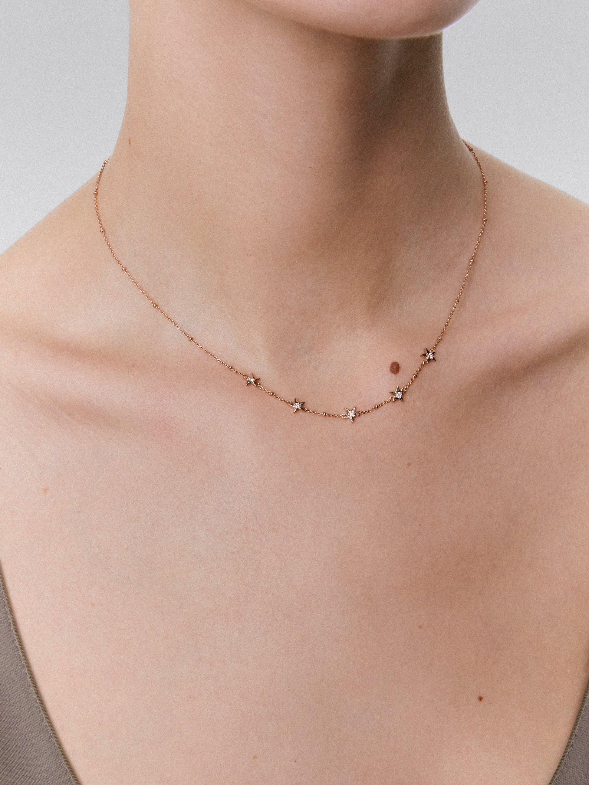 Colgante con estrellas de oro rosa de 18kt con diamantes