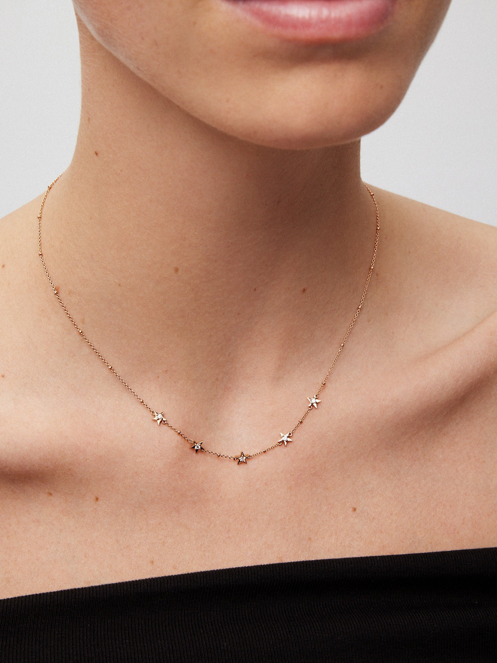 Colgante con estrellas de oro rosa de 18kt con diamantes