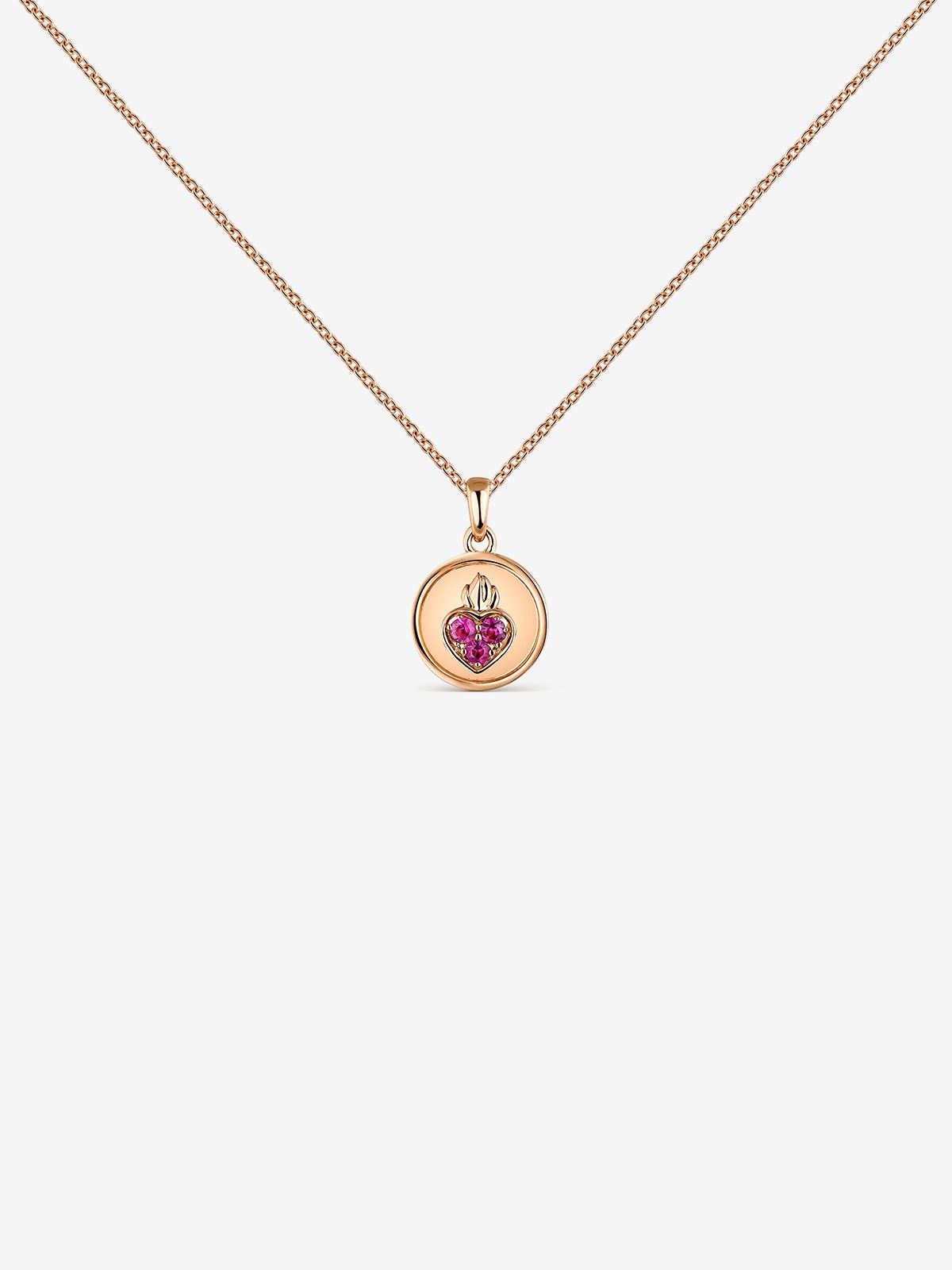 Colgante de oro rosa de 18kt con zafiros