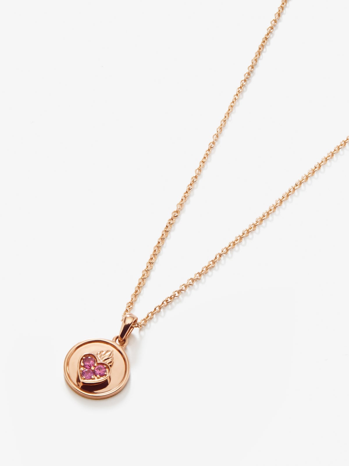 Colgante de oro rosa de 18kt con zafiros