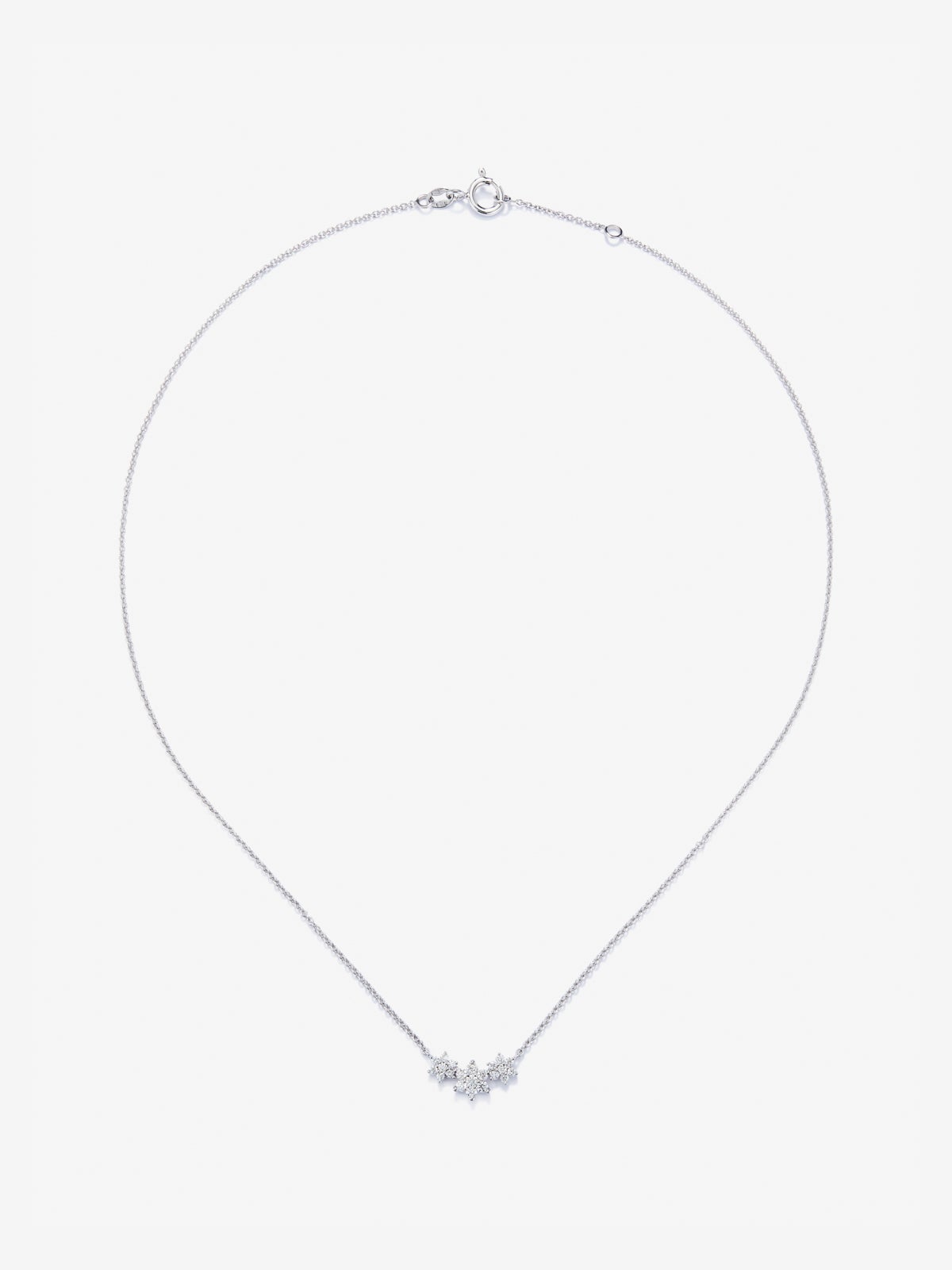 Colgante de oro blanco de 18K con diamantes en talla brillante de 0,29 cts y forma de estrellas