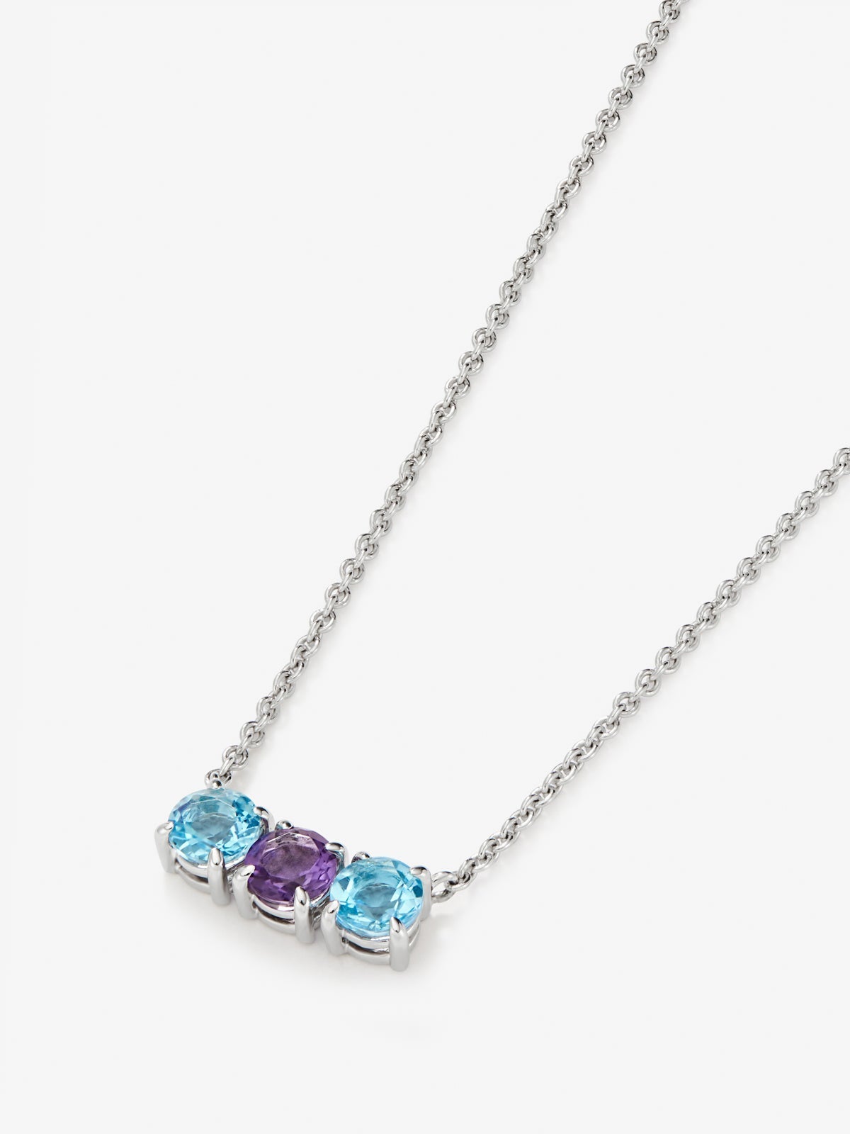 Colgante tresillo de plata 925 con topacios azuls swiss y amatista morada