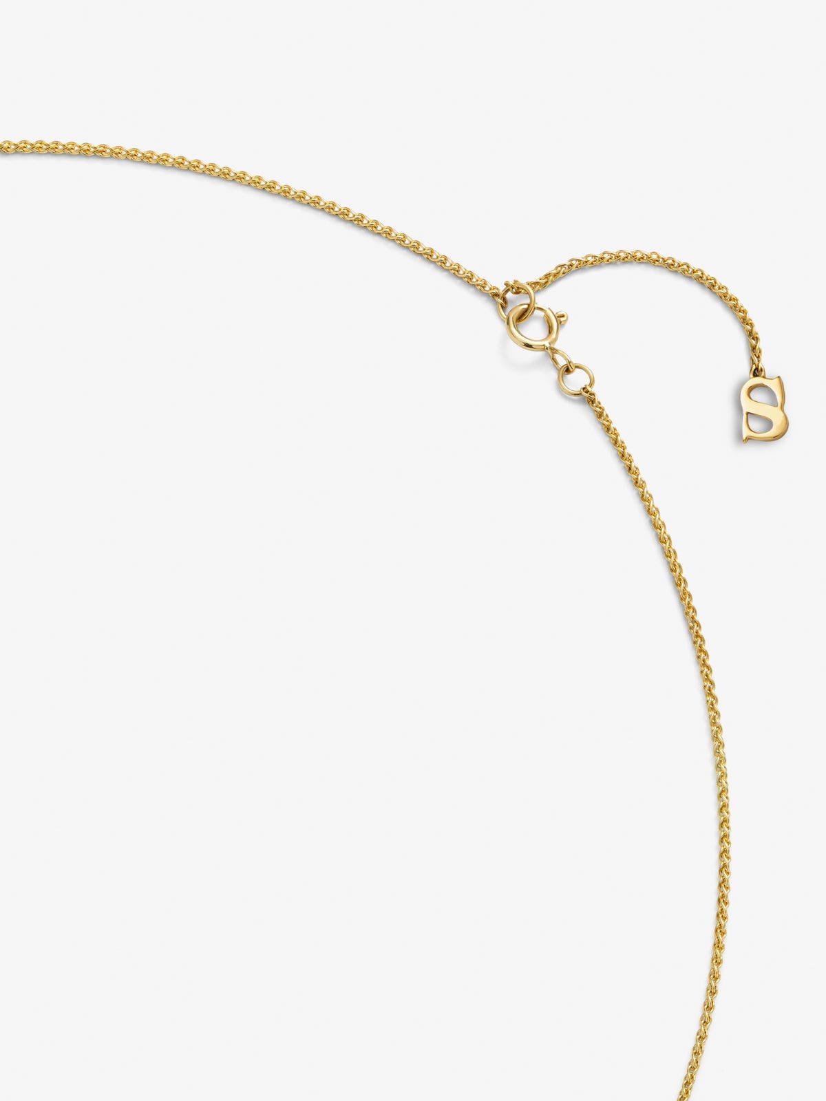 Colgante de oro amarillo de 18K con 26 diamantes en talla brillante con un total de 0,16 cts y forma de nudo