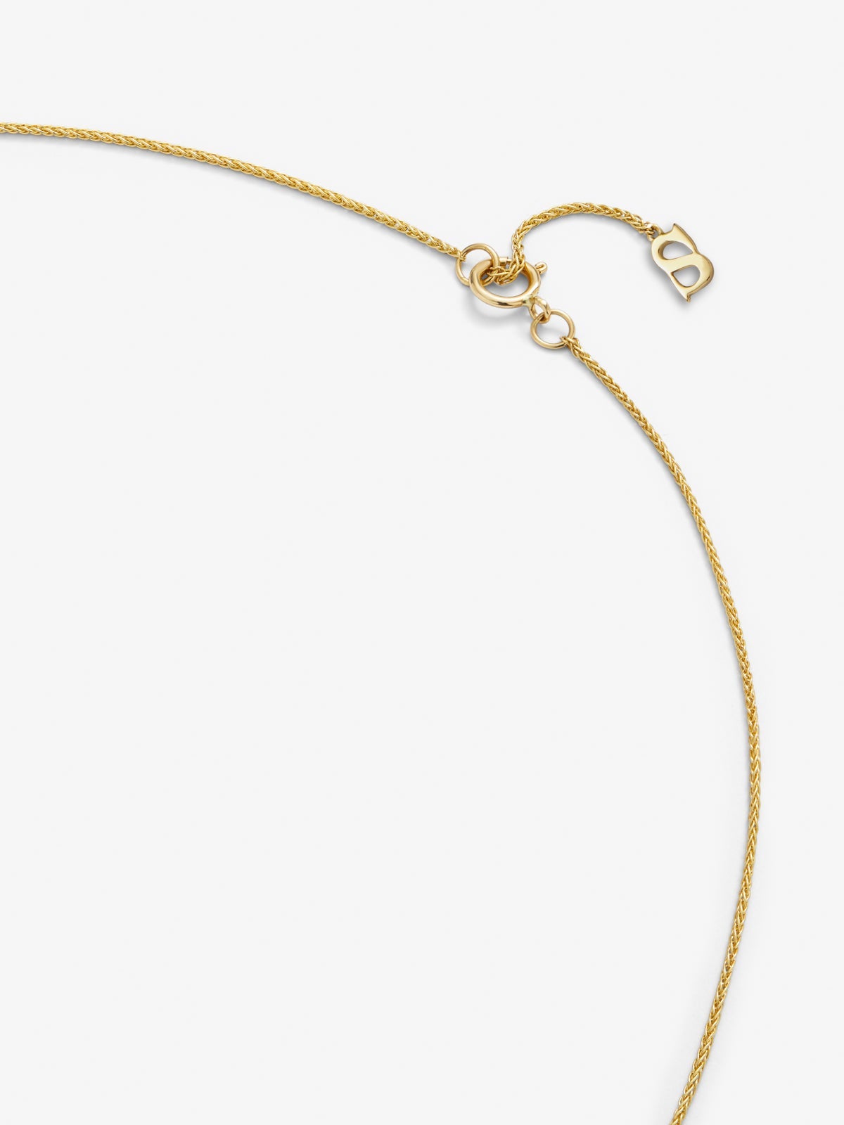 Colgante de oro amarillo de 18K con diamantes blancos en talla brillante de 0,05 cts y forma de nudo