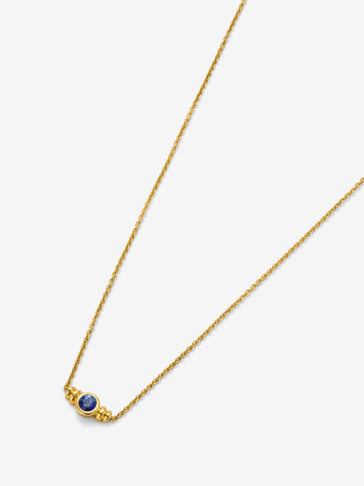 Colgante de oro amarillo de 18K con zafiro en talla brillante de 0,1cts 