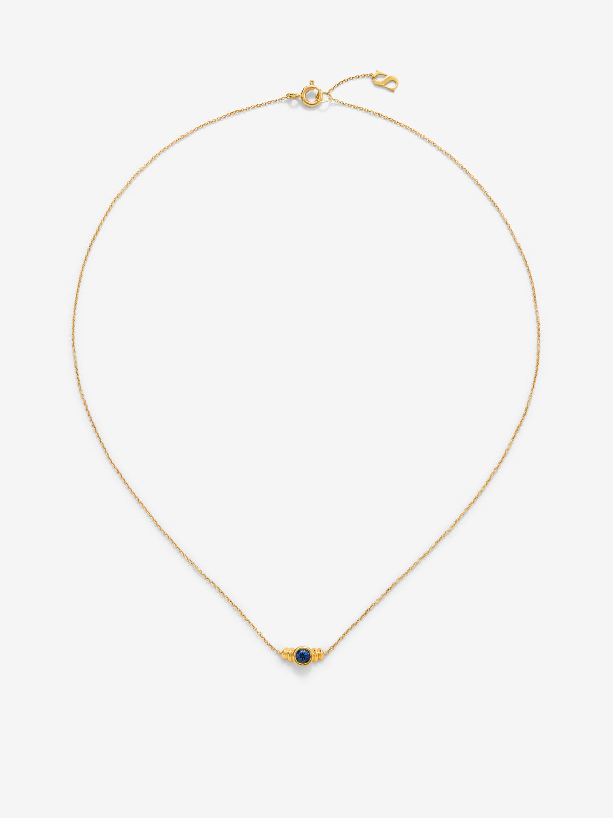 Colgante de oro amarillo de 18K con zafiro azul en talla brillante de 0,15 cts