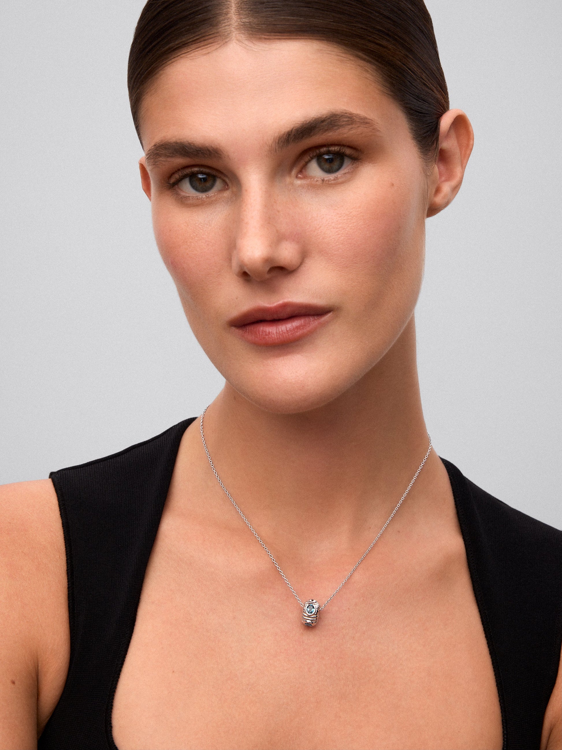 Colgante de plata 925 con topacio azul London y azul swiss