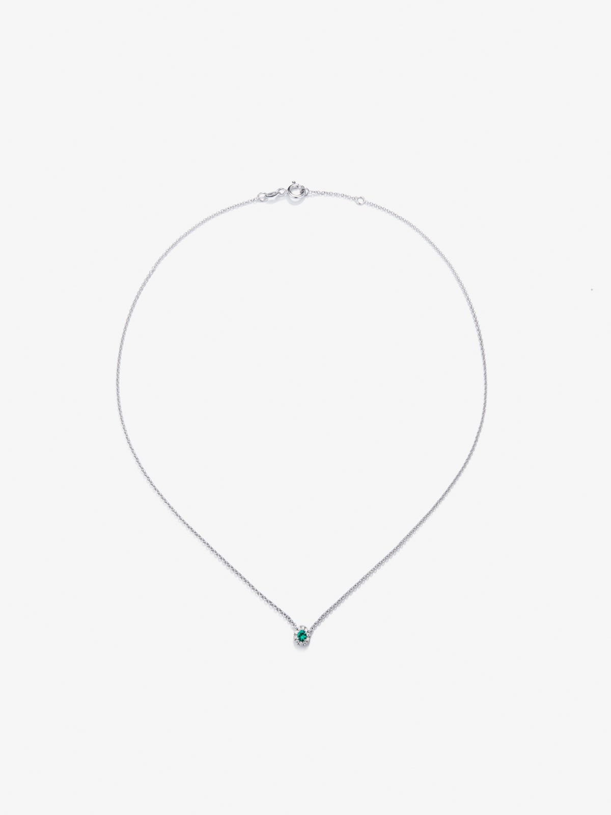 Colgante cadena orla de oro blanco de 18K con esmeralda y diamante