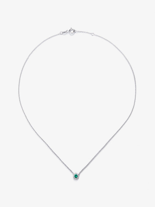 Colgante de oro blanco de 18K con esmeralda en talla brillante de 0,33 cts y diamantes en talla brillante de 0,09 cts