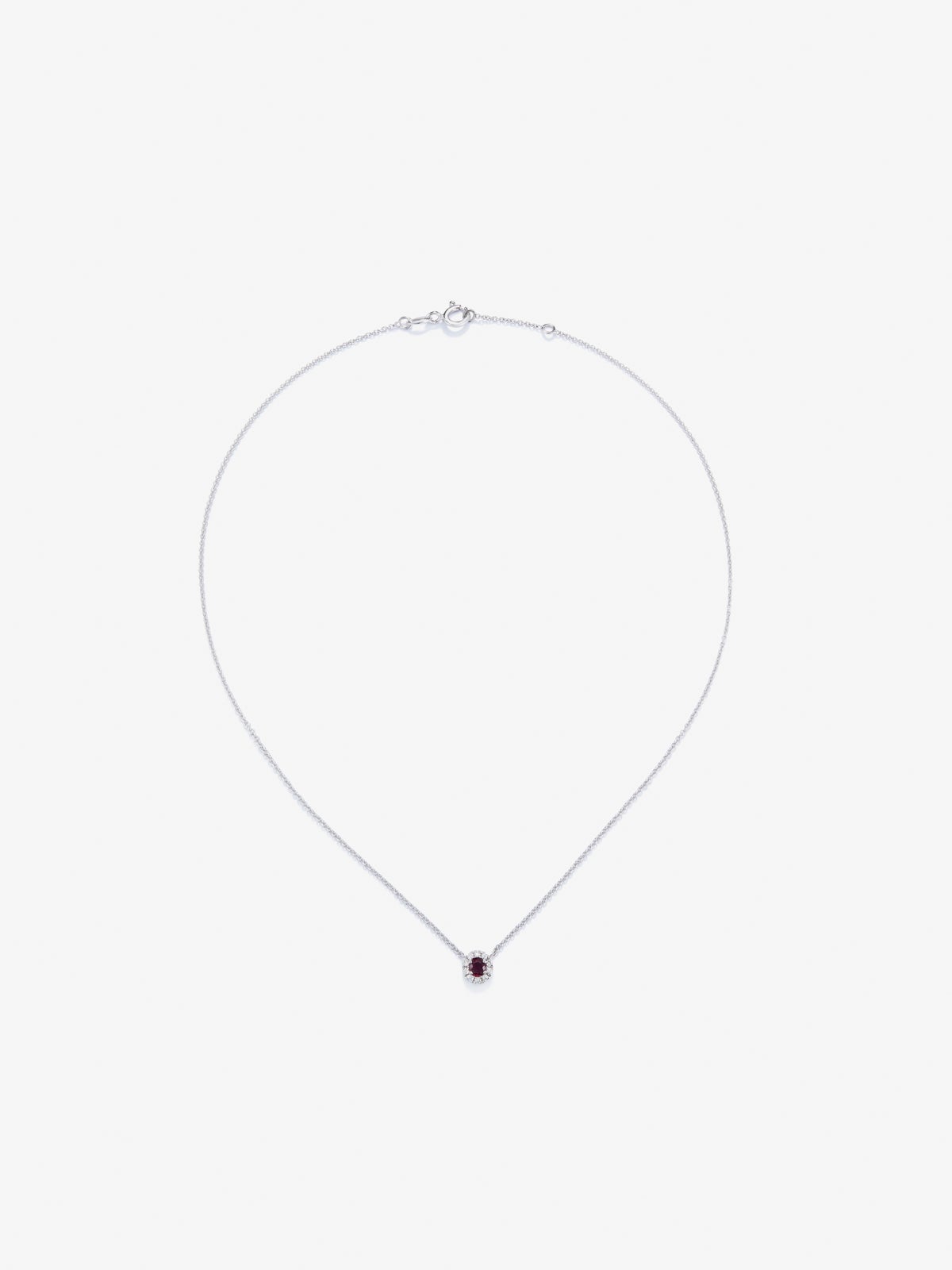 Colgante de oro blanco de 18K con rubí en talla brillante de 0,19 cts y diamantes en talla brillante de 0,05 cts