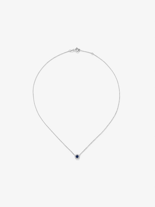 Colgante de oro blanco de 18K con zafiro azul en talla brillante de 0,2 cts y diamantes en talla brillante de 0,05 cts
