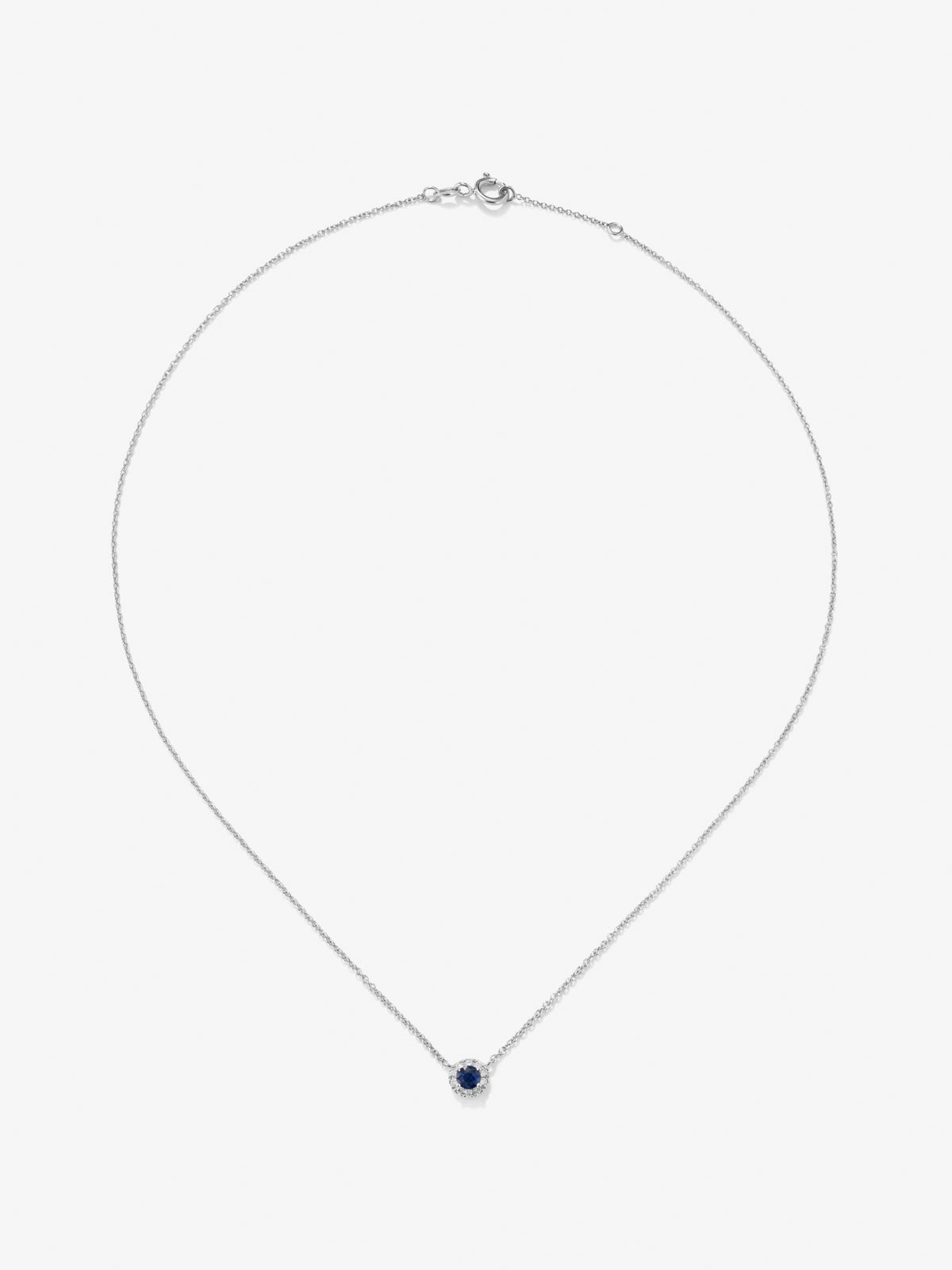 Colgante de oro blanco de 18K con zafiro azul en talla brillante y diamantes