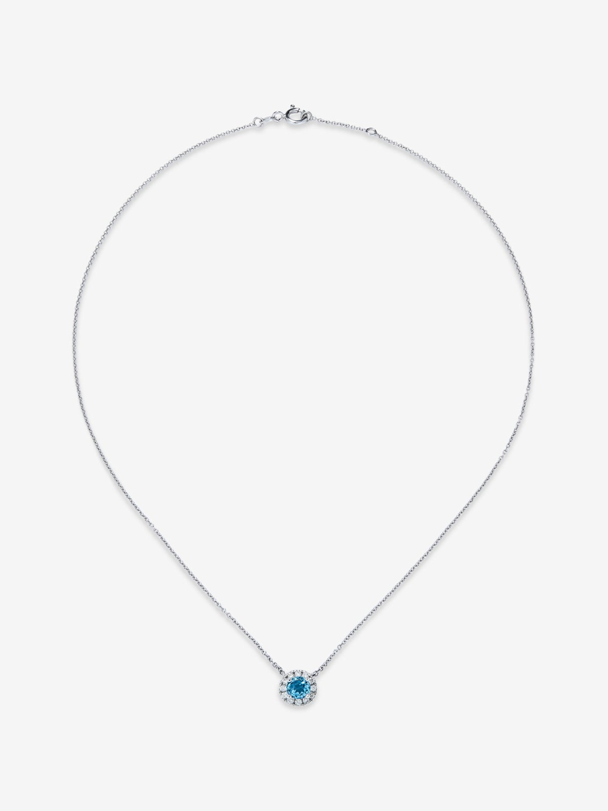 Colgante de oro blanco de 18K con topacio azul swiss 0,63 cts y diamantes 0,13 cts