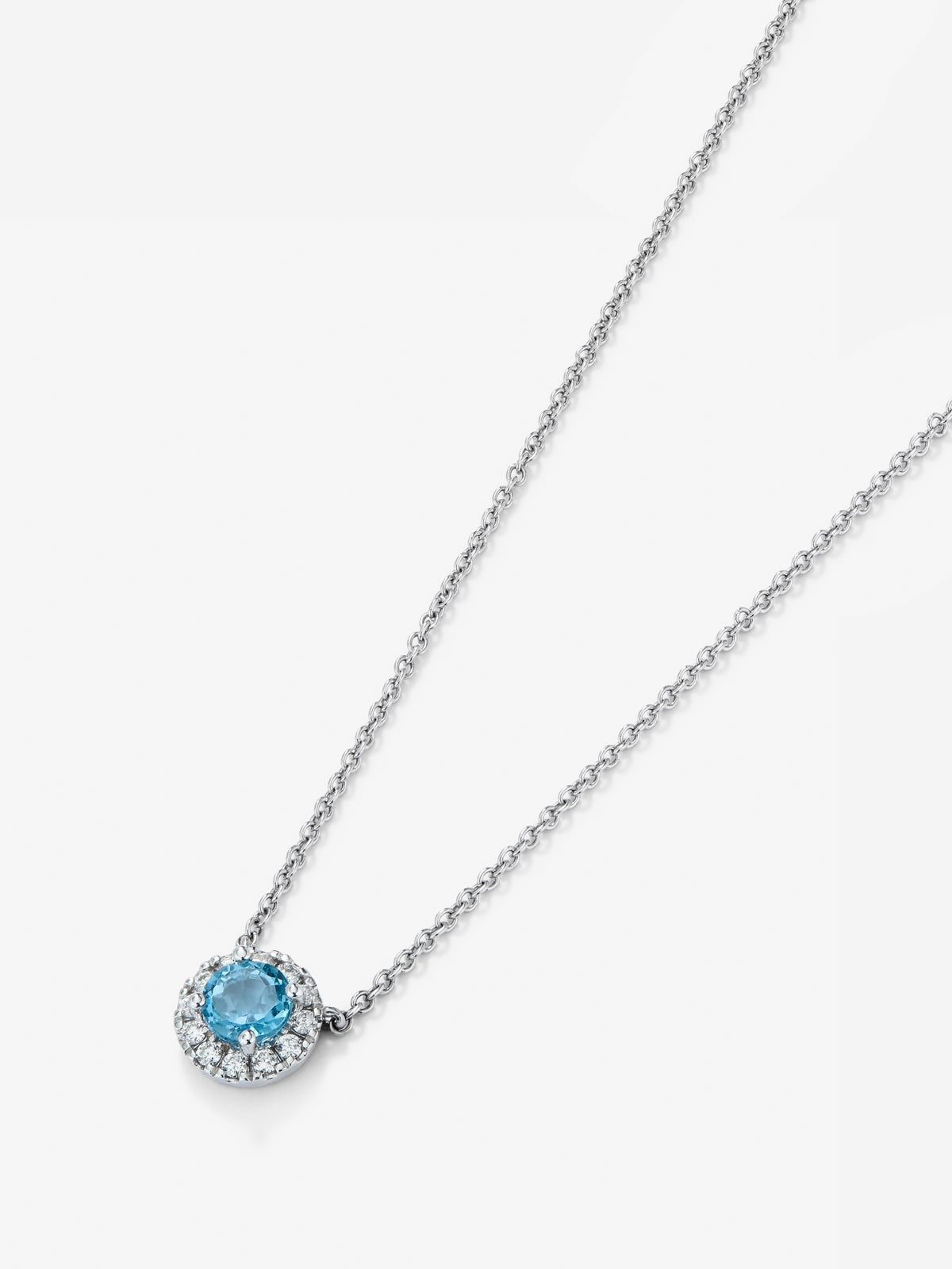 Colgante de oro blanco de 18K con topacio azul swiss 0,63 cts y diamantes 0,13 cts
