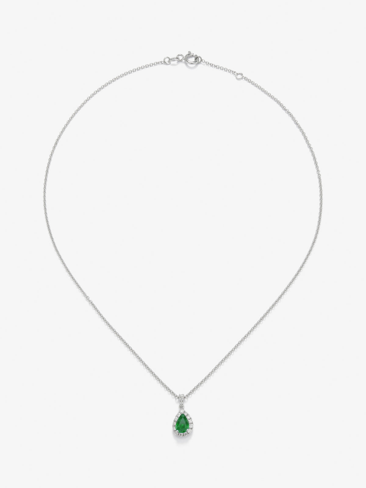 Colgante de oro blanco de 18K con esmeralda y diamantes en talla brillante con un total de 0,15 cts
