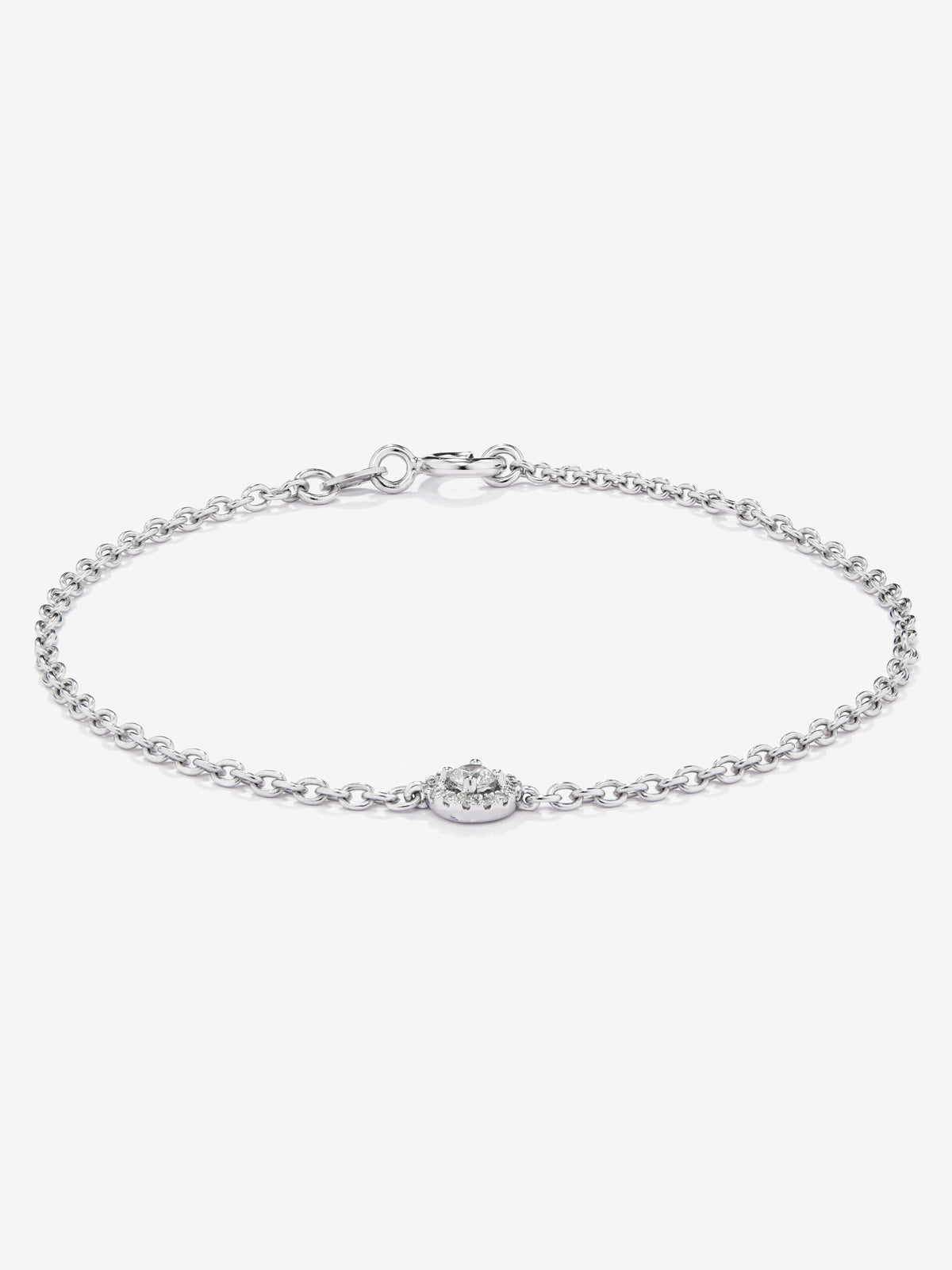 Pulsera cadena de oro blanco de 18K con diamante solitario y orla de diamantes