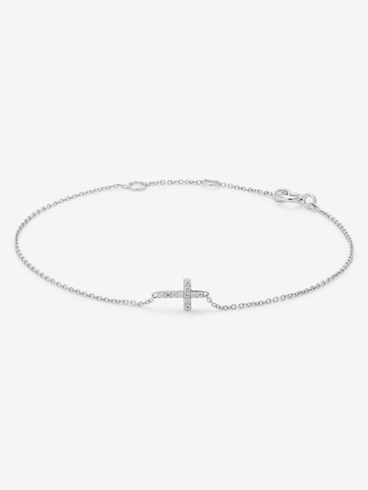 Pulsera de oro blanco de 18K con cruz y diamantes en talla brillante con un total de 0,04 cts