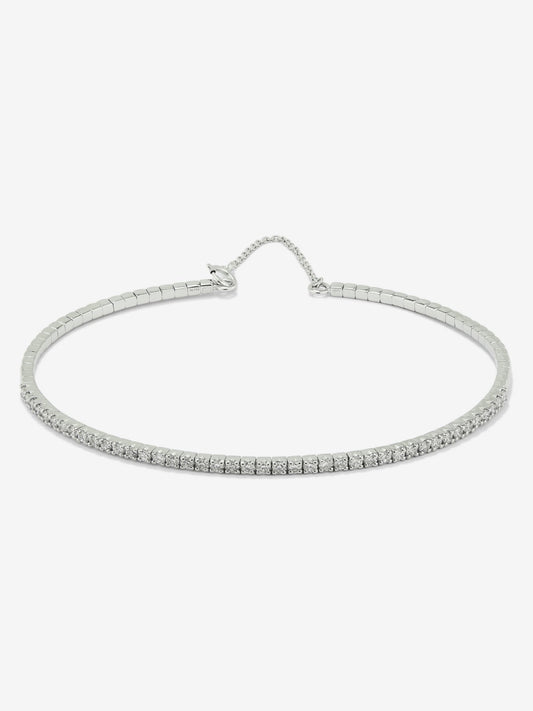 Pulsera rígida de oro blanco de 18K con 42 diamantes en talla brillante con un total de 0,71 cts