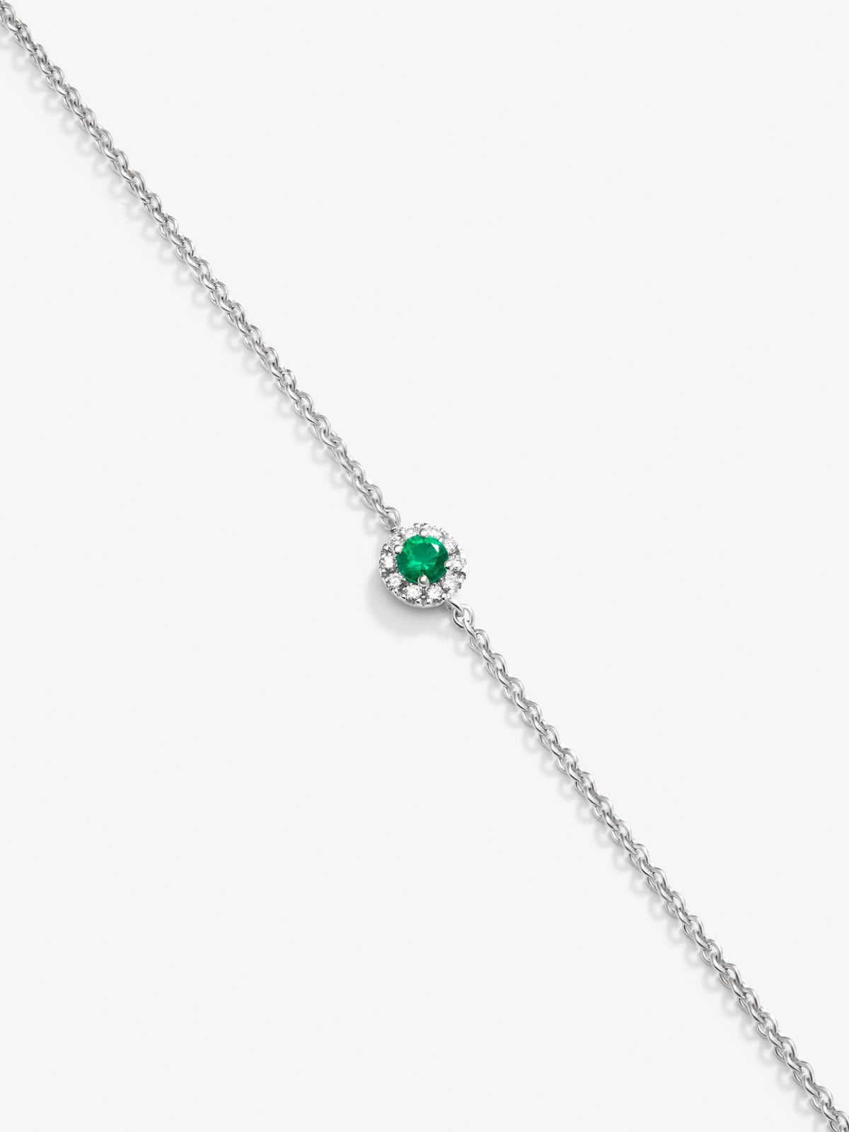 Pulsera de oro blanco de 18K con esmeralda en talla brillante de 0,1 cts y diamantes en talla brillante de 0,05 cts