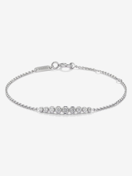 Pulsera de oro blanco de 18K con 9 diamantes en talla brillante con un total de 0,29 cts