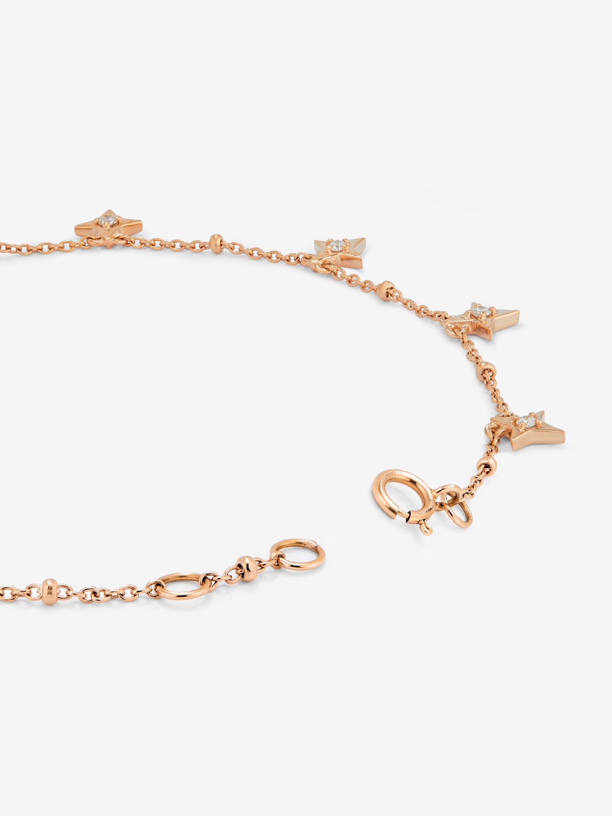 Pulsera cadena con estrellas de oro rosa de 18K con diamantes
