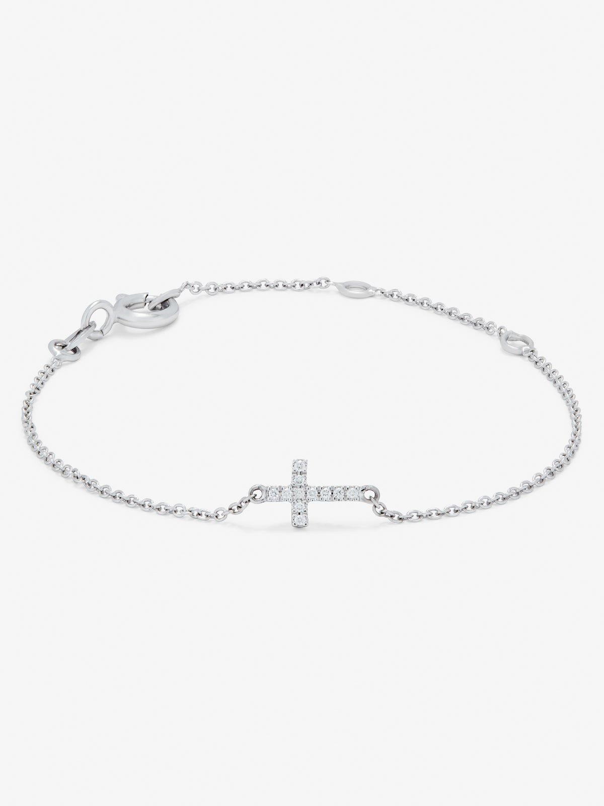 Pulsera de oro blanco de 18K con 11 diamantes en talla brillante con un total de 0,04 cts y cruz