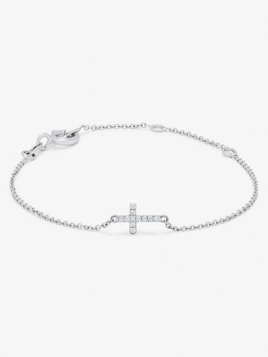 Pulsera de oro blanco de 18K con 11 diamantes en talla brillante con un total de 0,04 cts y cruz