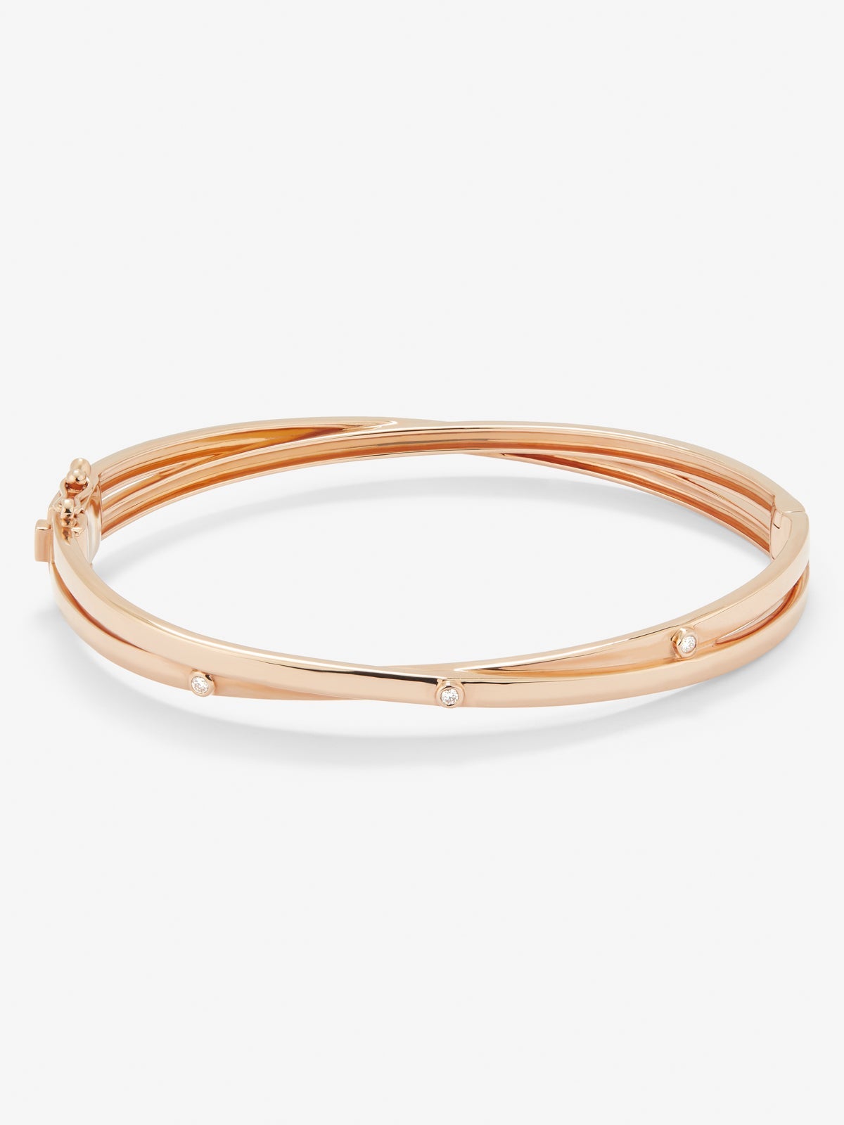 Pulsera rígida de oro rosa de 18K con 3 diamantes en talla brillante con un total de 0,04 cts