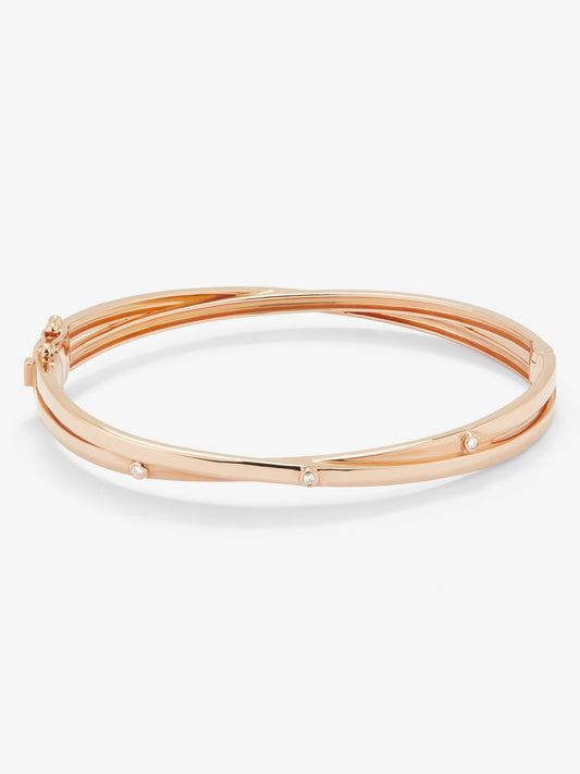 Pulsera rígida de oro rosa de 18K con 3 diamantes en talla brillante con un total de 0,04 cts