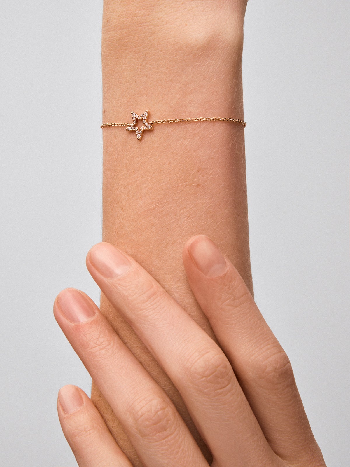 Pulsera cadena con estrella de oro rosa de 18K con diamantes