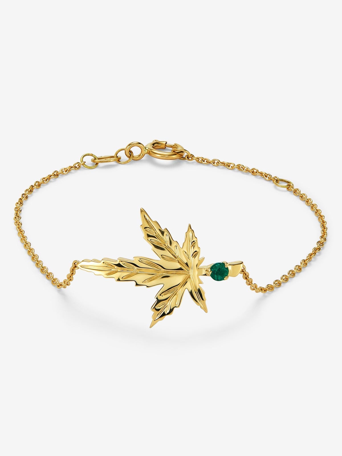 Pulsera de oro amarillo de 18K con una esmeralda en talla brillante de 0,11 cts y forma de hoja de arce