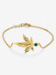 Pulsera de oro amarillo de 18K con una esmeralda en talla brillante de 0,11 cts y forma de hoja de arce